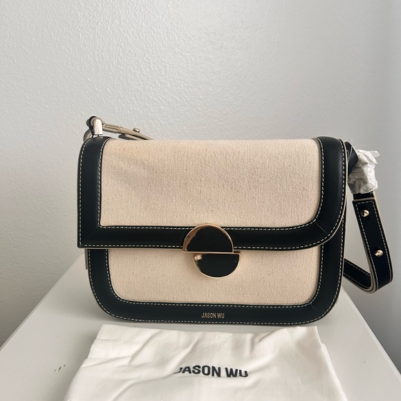 Jason Wu
Orbit Canvas / Leather Shoulder Bag NWT Color Beige/ Black - Picture 6 of 14